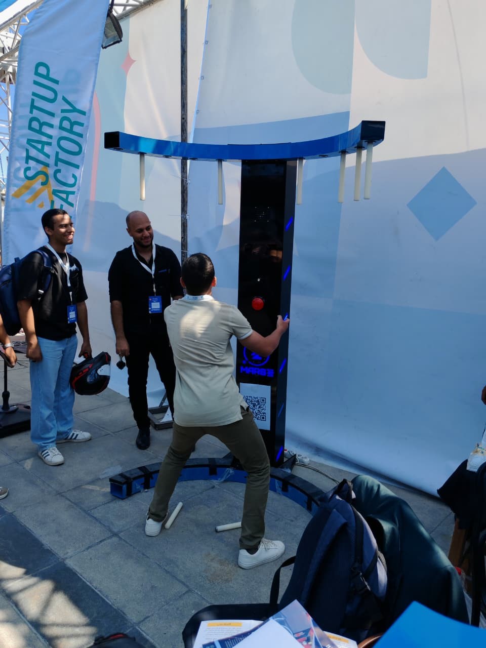 MARS-Z falling sticks arcade game being played at a live event